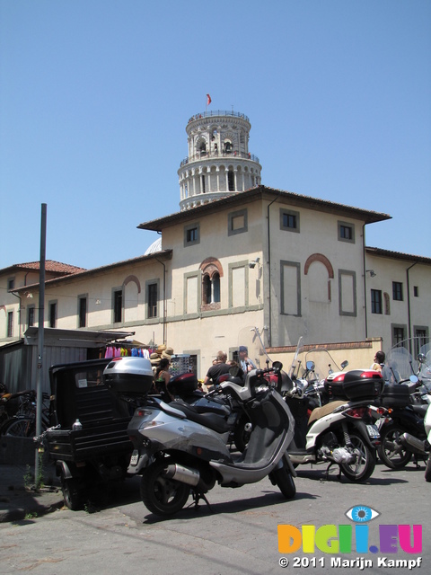 SX19788 Leaning tower of Pisa sticking out over building, Italy